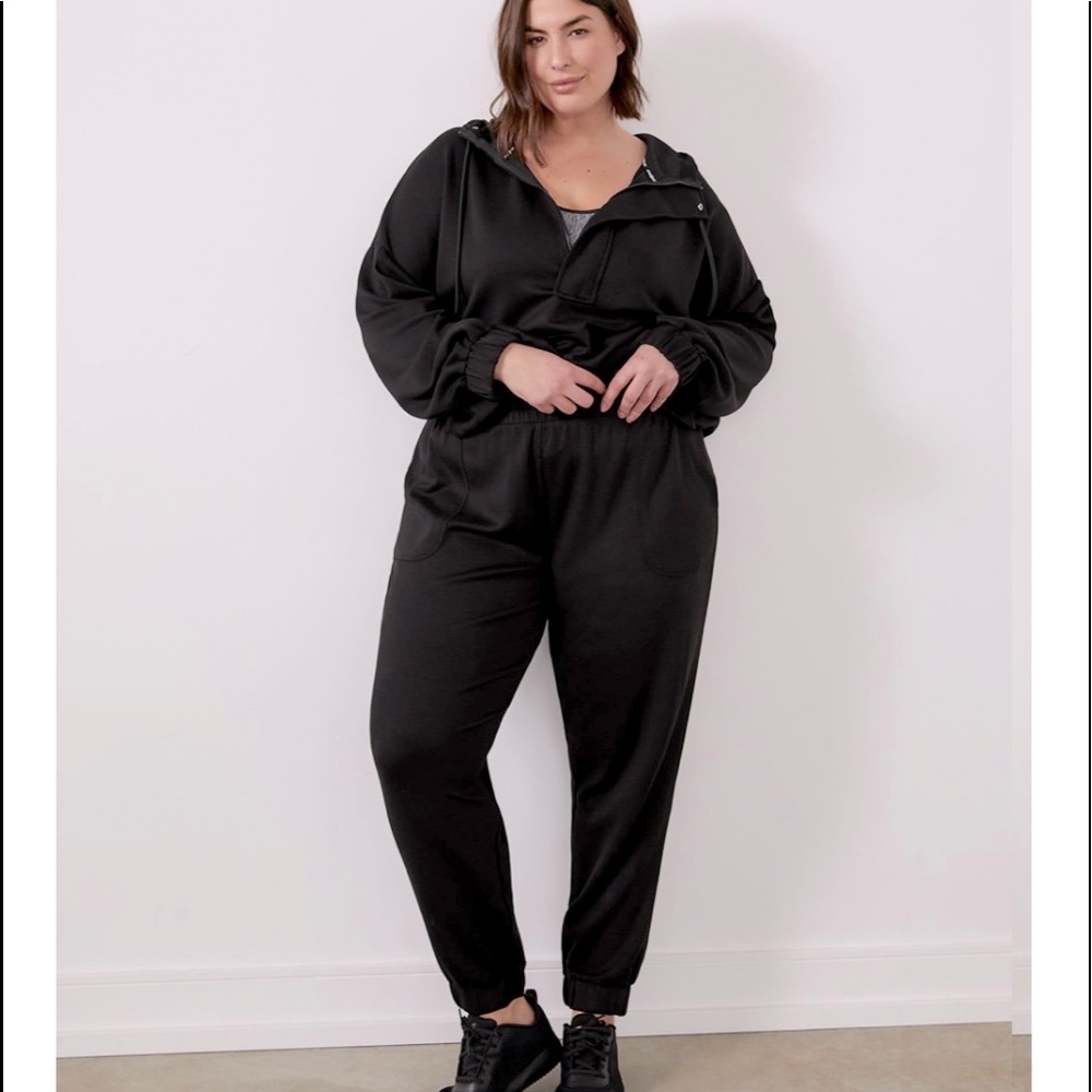 Black joggers with tie and elastic on waistband and ankles.